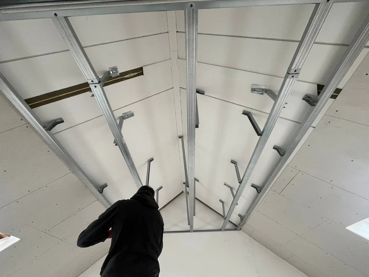 Ceiling frame for a suspended plasterboard ceiling in an attic